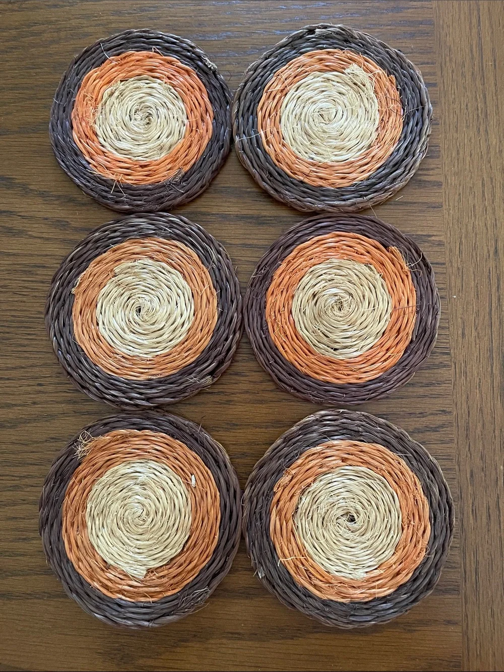 Vintage Round Woven Coasters in Brown, Orange, and Natural